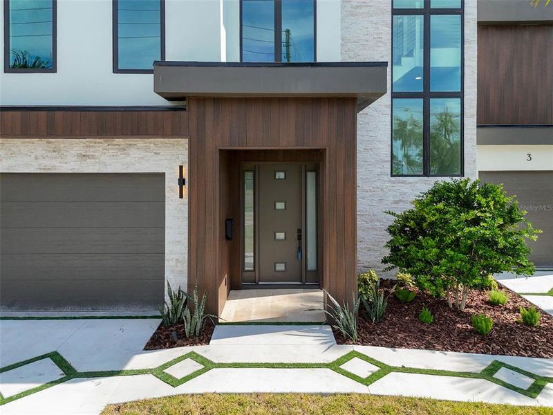 Front exterior of a new home in , Treasure Island, FL, highlighting curb appeal (Image 30). Front exterior of a new home in , Treasure Island, FL, highlighting curb appeal (Image 30).