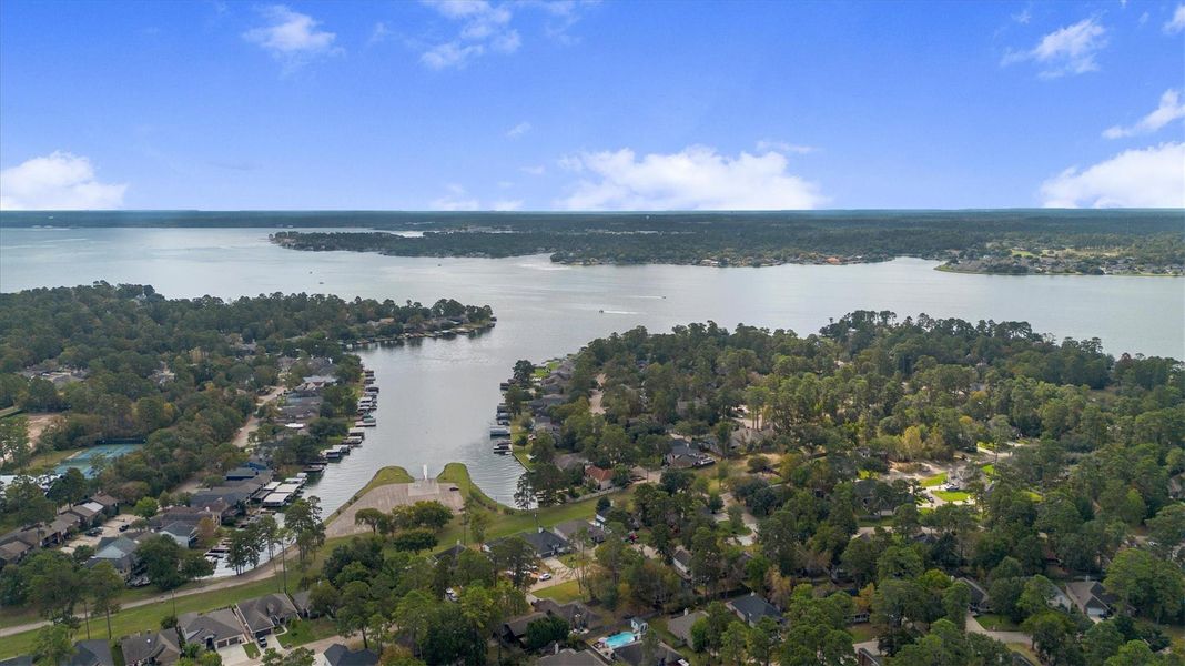 Experience serene lakeside living with direct access to the scenic beauty of Lake Conroe, perfect for water enthusiasts and nature lovers alike.