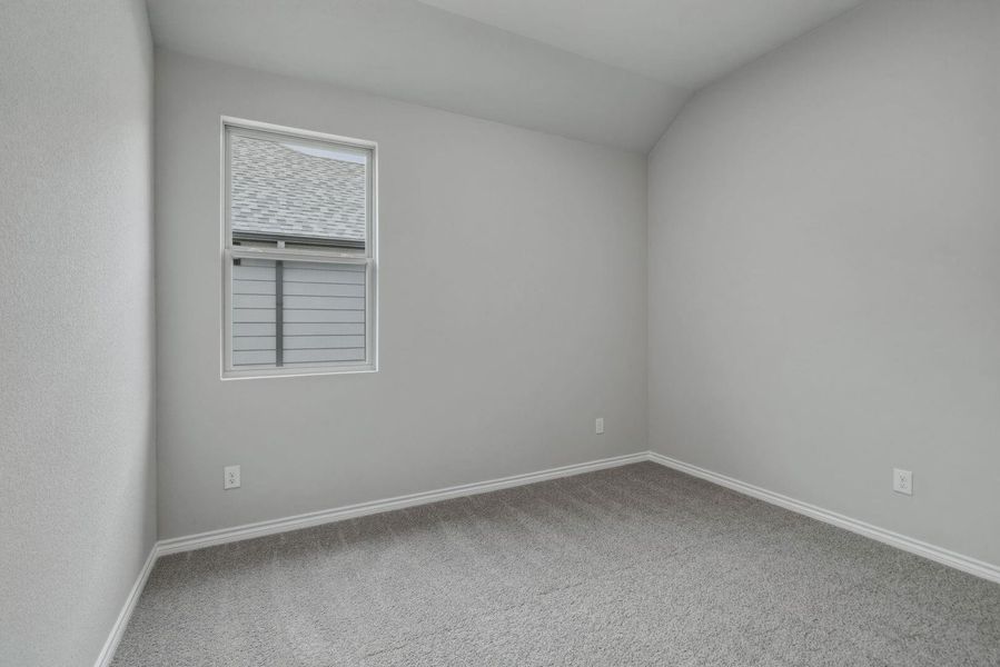 Bedroom in the Cedar home plan by Trophy Signature Homes – REPRESENTATIVE PHOTO