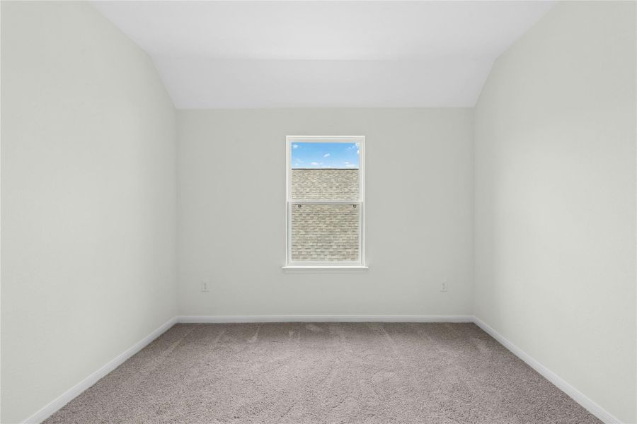 Spare room featuring light colored carpet and baseboards Spare room featuring light colored carpet and baseboards
