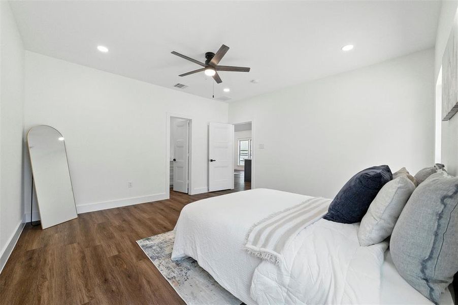 Bedroom featuring wood finished floors, recessed lighting, and ceiling fan