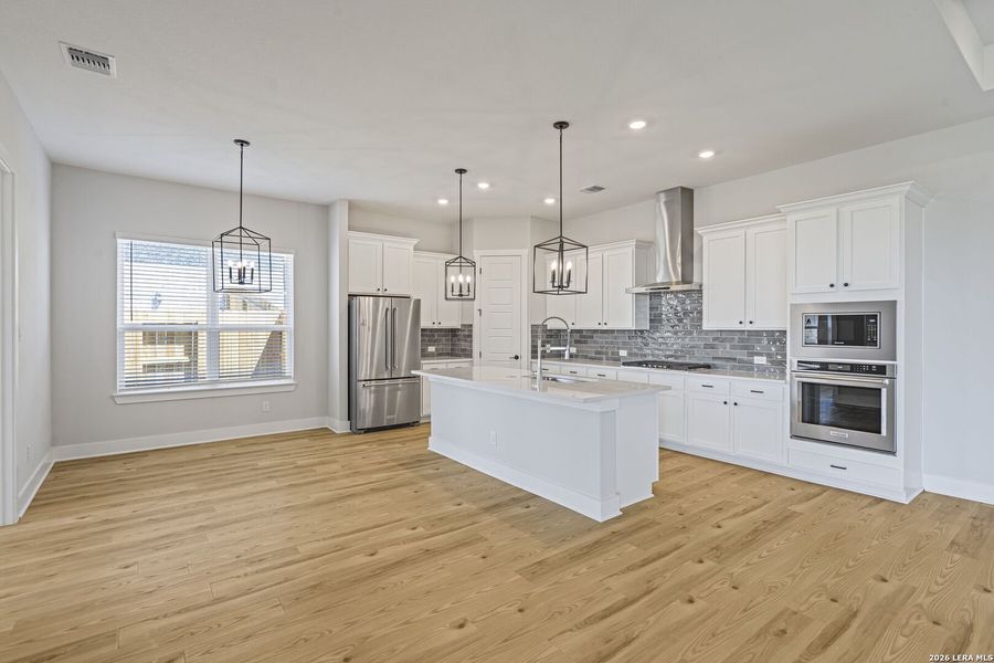 Furnished interior view inside a new home in Potranco West, Castroville (Image 9).