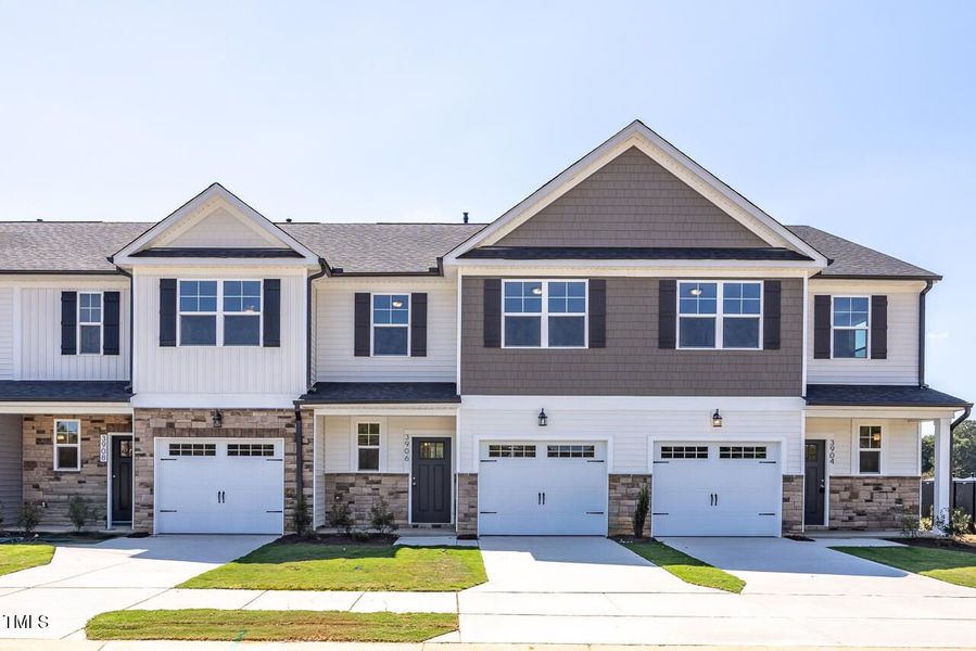 Front exterior of a new home in Springvale, Fuquay Varina, NC, highlighting curb appeal (Image 1). Front exterior of a new home in Springvale, Fuquay Varina, NC, highlighting curb appeal (Image 1).
