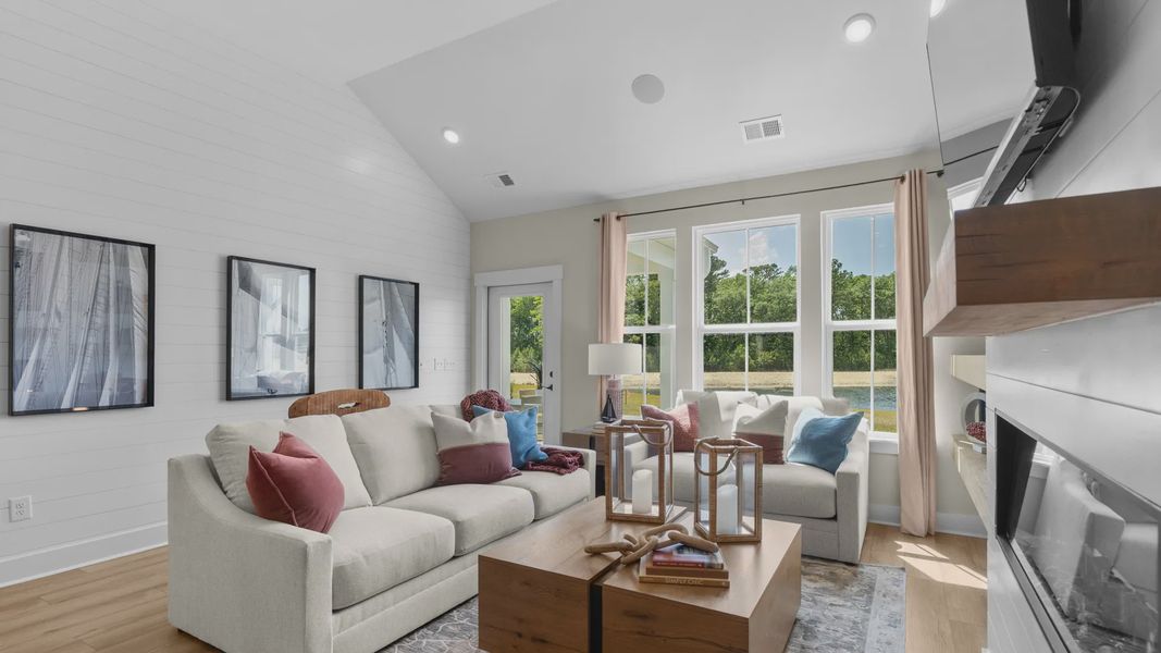 Inviting living room in the Summit home plan with bright windows and open design.