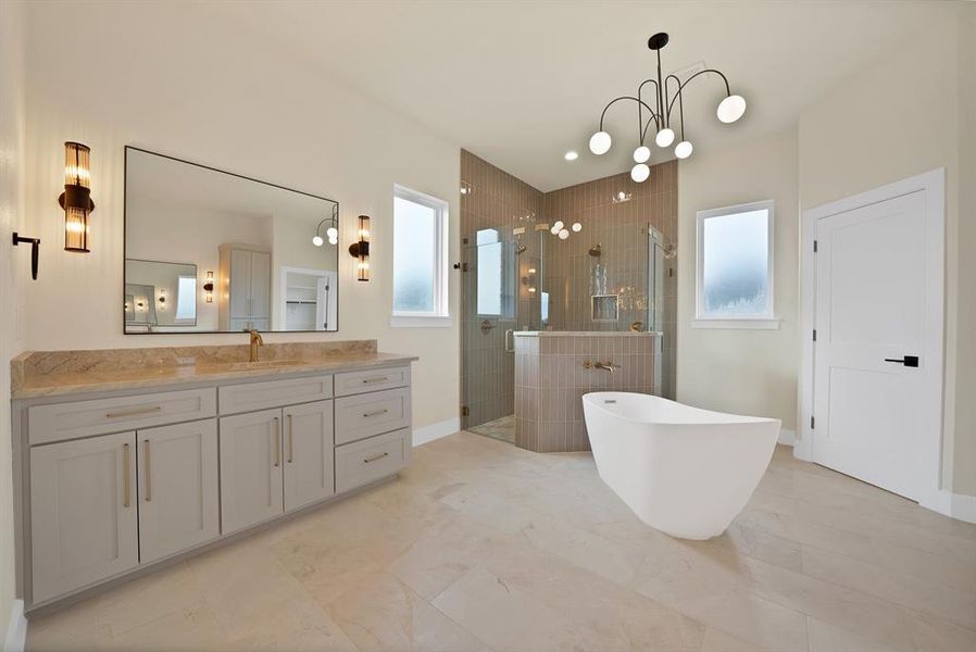 Bathroom with a soaking tub, a stall shower, vanity, and plenty of natural light Bathroom with a soaking tub, a stall shower, vanity, and plenty of natural light