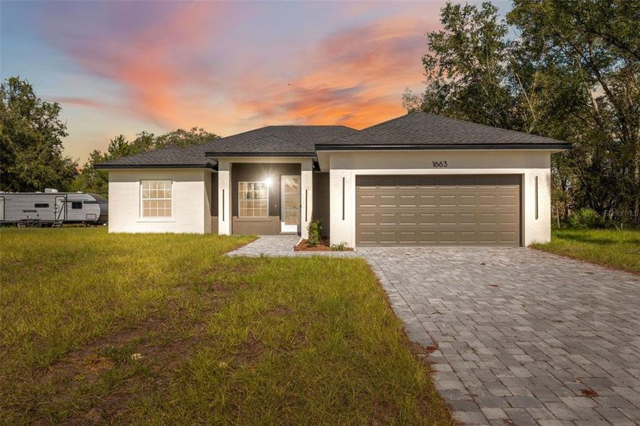 Front exterior of a new home in , Ocala, FL, highlighting curb appeal (Image 2). Front exterior of a new home in , Ocala, FL, highlighting curb appeal (Image 2).