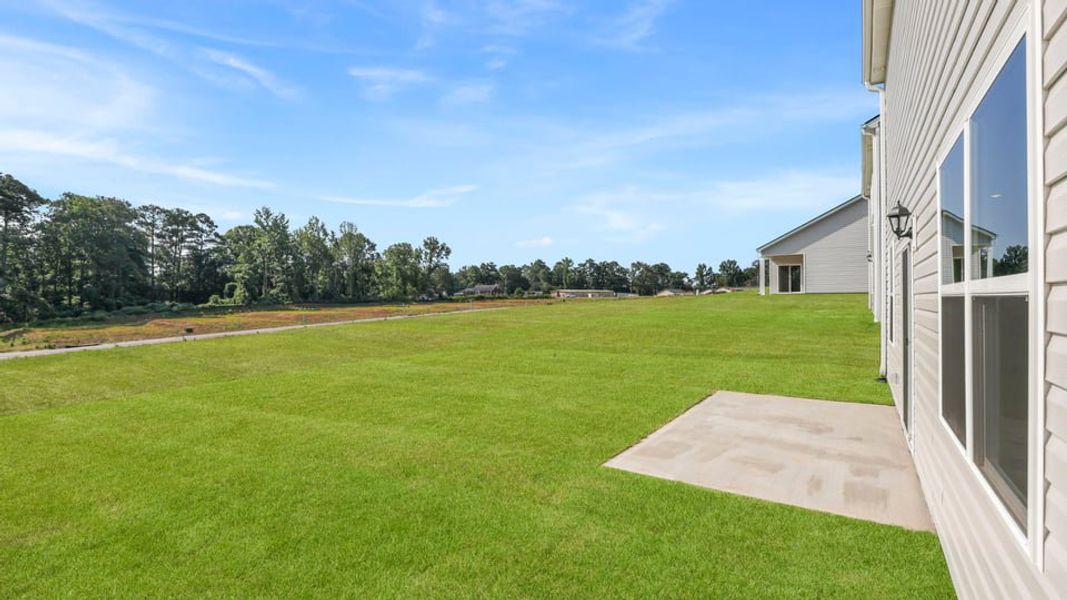 Exterior details and patio area of a home in Waverly Station, Greenwood (Image 19).