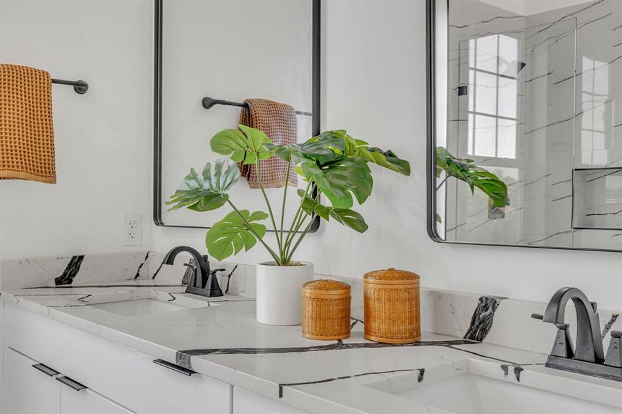 Interior details featuring vanity and walk in shower