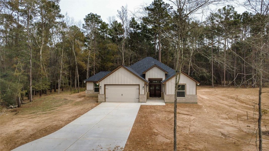 Front exterior of a new home in , Porter, TX, highlighting curb appeal (Image 25).