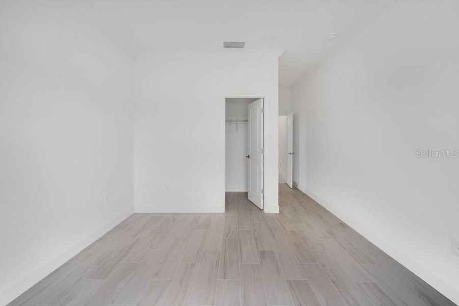 Spacious, unfurnished interior of a new home in Harvest at Ovation, Winter Garden (Image 31).