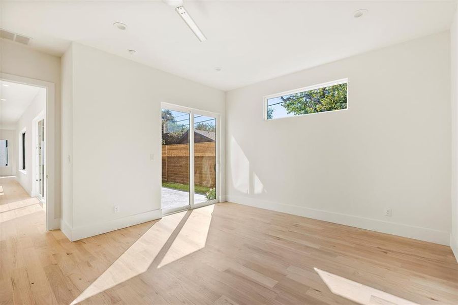 Empty room featuring light wood-type flooring