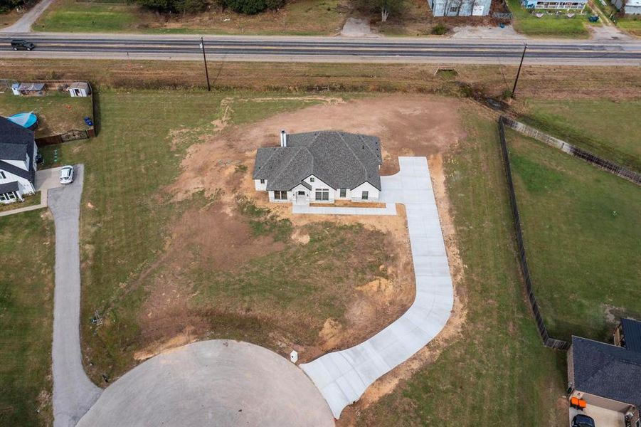 Aerial view of property and surrounding area with rural landscape