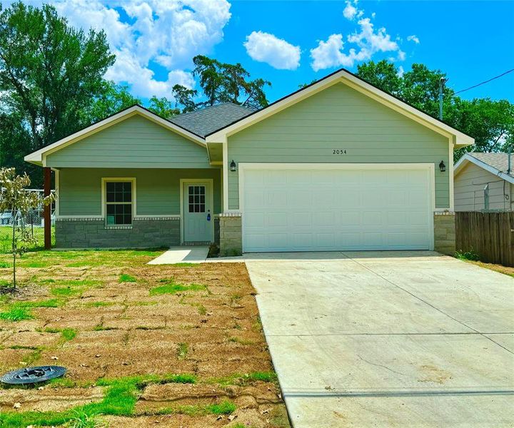 Ranch-style home featuring a garage