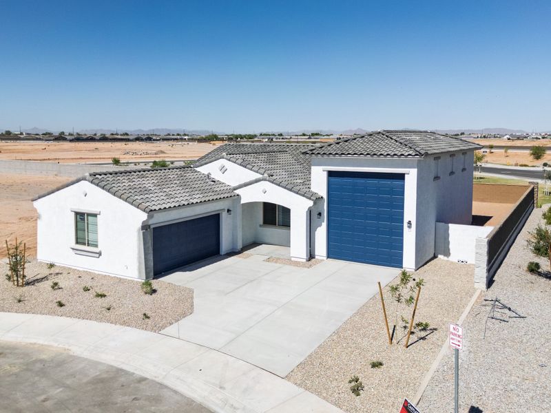 Front exterior of a new home in Rancho Mirage, Maricopa, AZ, highlighting curb appeal (Image 27). Front exterior of a new home in Rancho Mirage, Maricopa, AZ, highlighting curb appeal (Image 27).