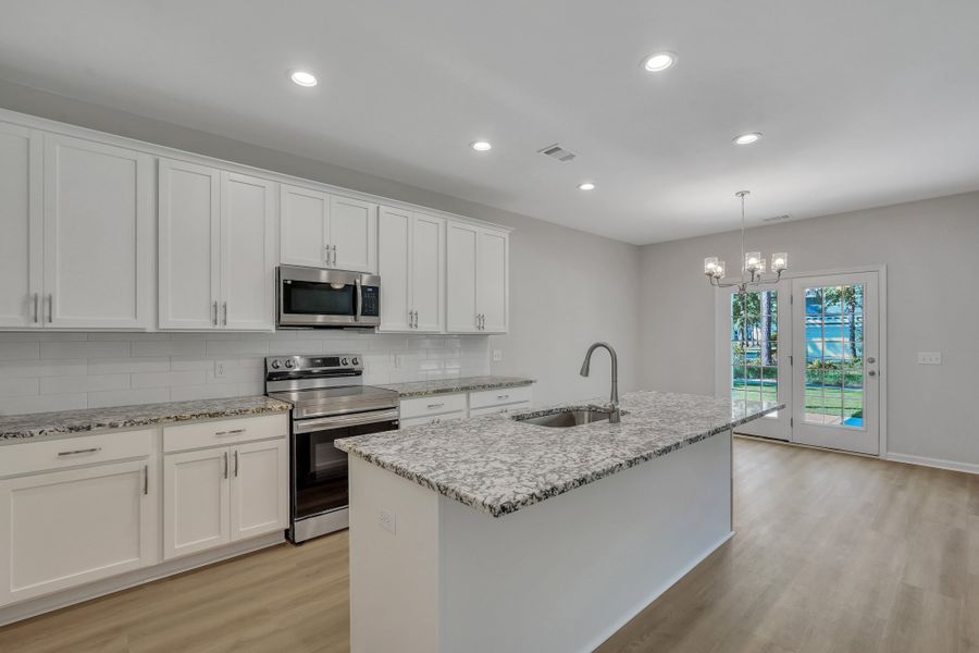 Representative furnished interior of a home built from the The Hatteras by Smith Family Homes in Ramsey Landing, Rincon (Image 5).