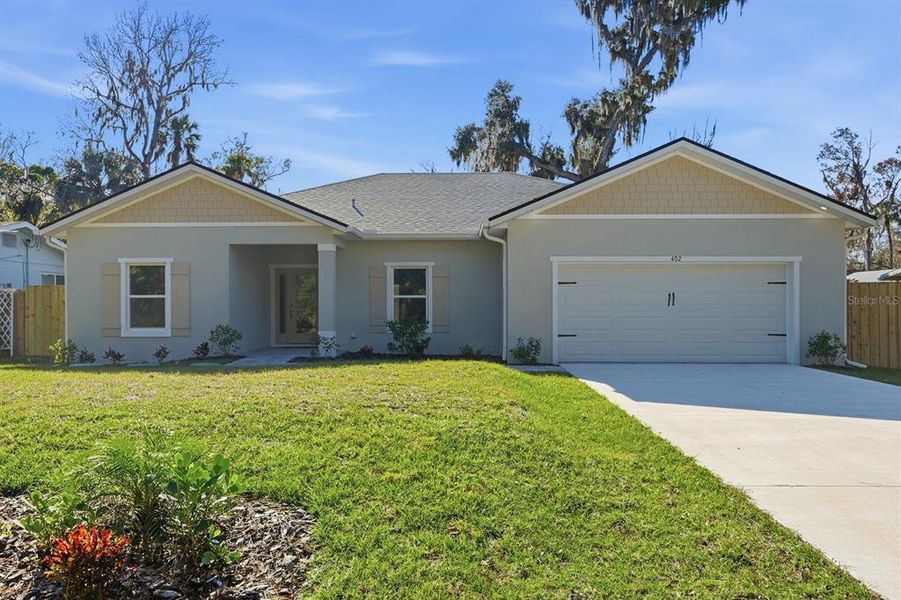Front exterior of a new home in , New Smyrna Beach, FL, highlighting curb appeal (Image 22).