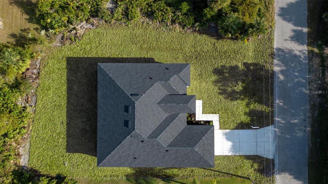 Front exterior of a new home in , North Port, FL, highlighting curb appeal (Image 26). Front exterior of a new home in , North Port, FL, highlighting curb appeal (Image 26).