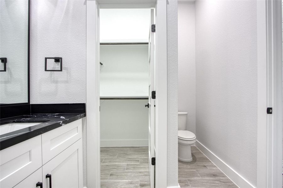 Wonderful Jack and Jill bath, each side complete with it's own sink, walk-in closet and toilet with shower in between. Wonderful Jack and Jill bath, each side complete with it's own sink, walk-in closet and toilet with shower in between.