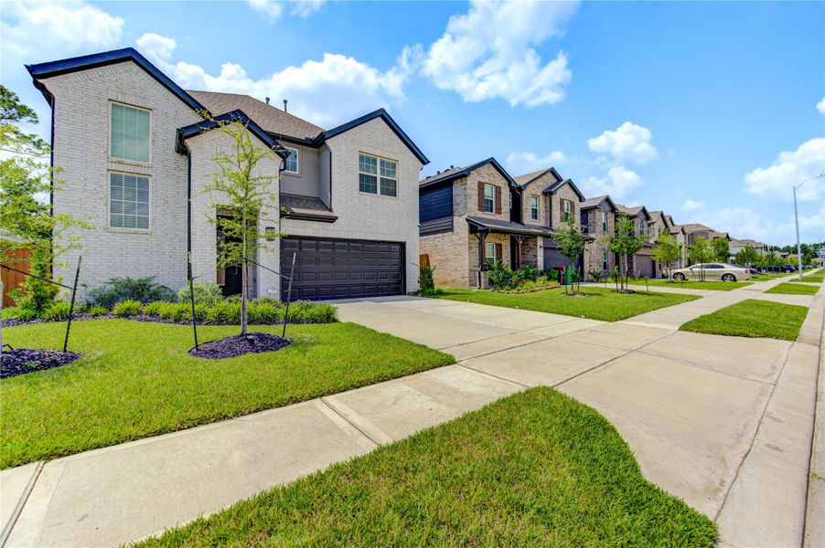 Front exterior of a new home in , Houston, TX, highlighting curb appeal (Image 22).