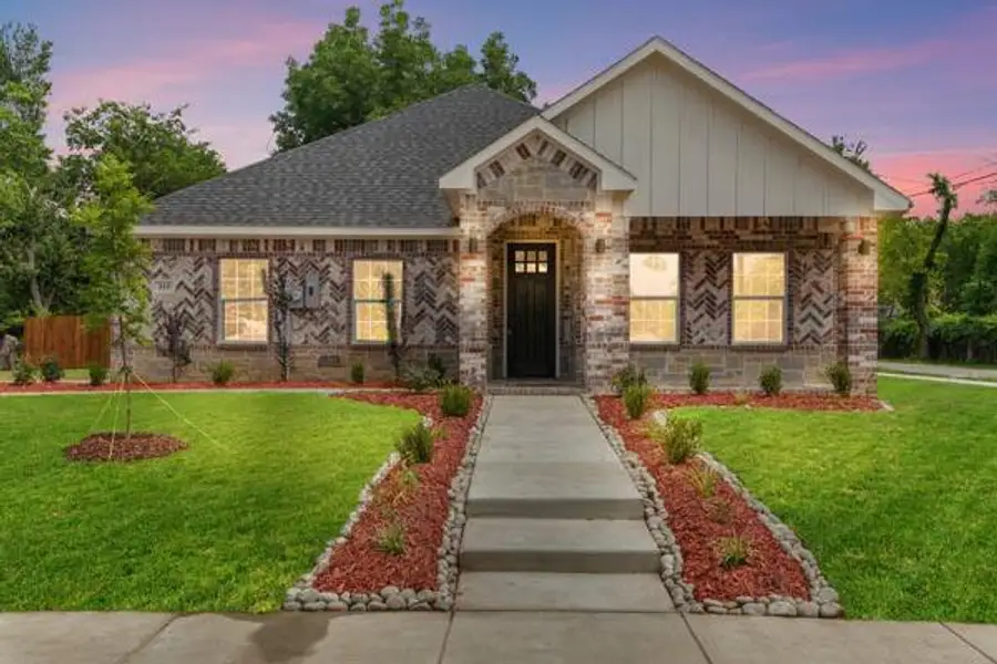 Brick and stone facade with a covered entry Brick and stone facade with a covered entry