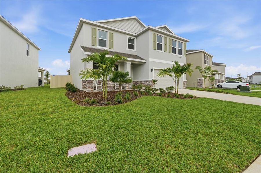 Front exterior of a new home in Solera at Lakewood Ranch, Lakewood Ranch, FL, highlighting curb appeal (Image 25). Front exterior of a new home in Solera at Lakewood Ranch, Lakewood Ranch, FL, highlighting curb appeal (Image 25).