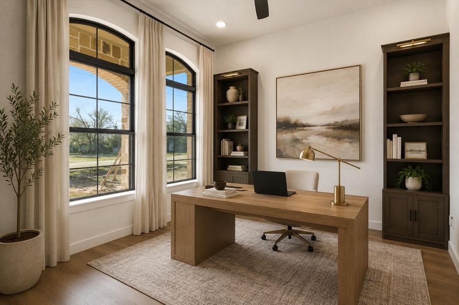 A dedicated first floor office features beautiful forward-facing windows, a ceiling fan, and recessed lighting. Perfect for a bright, comfortable workspace. (Virtually Staged)