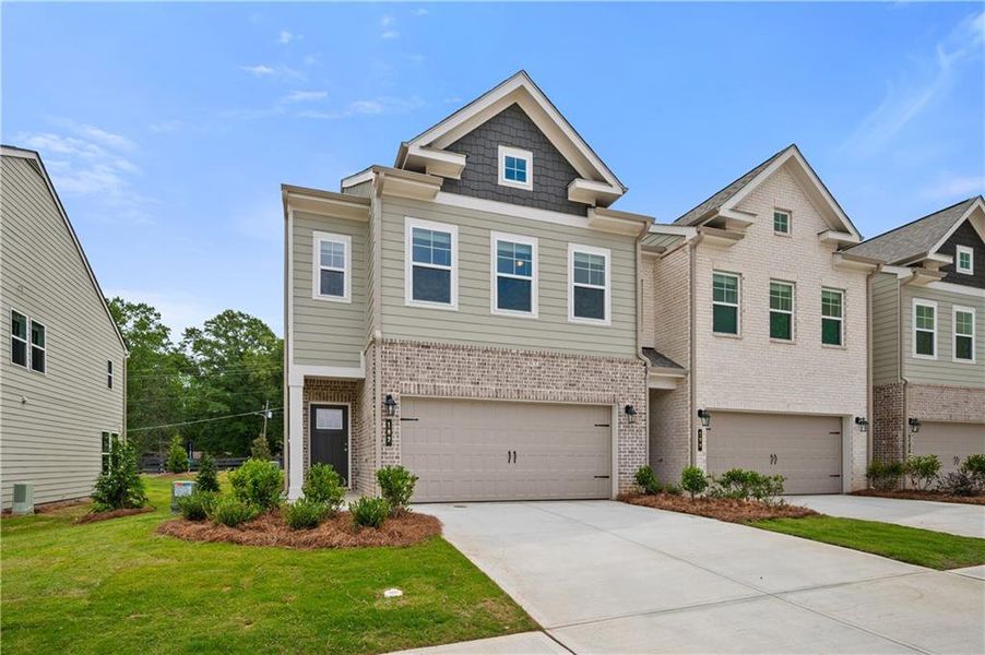 Front exterior of a new home in Langley Overlook, Loganville, GA, highlighting curb appeal (Image 23).