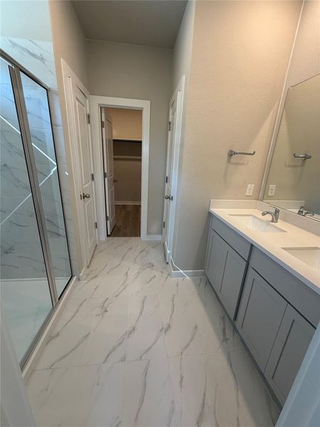 Primary Bath retreat with dual vanities & walk-in shower