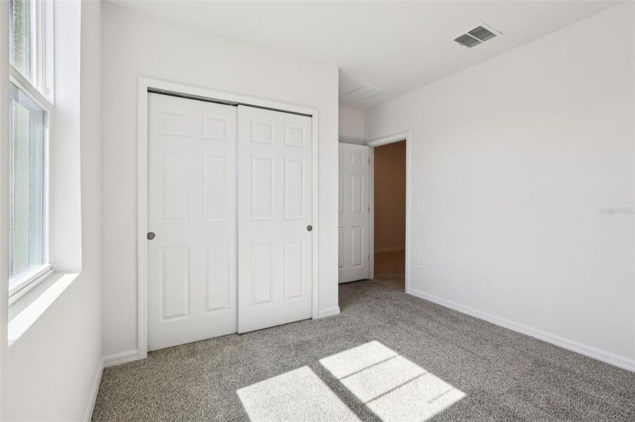 Spacious, unfurnished interior of a new home in Lake Deer Estates - Signature Series, Poinciana (Image 20).