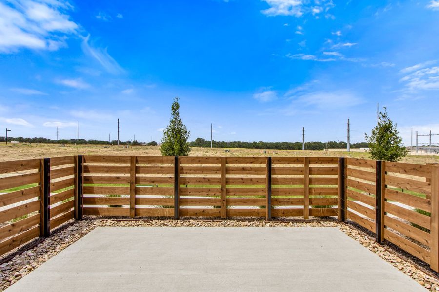 Exterior details and patio area of a home in Wildridge, Oak Point (Image 28).