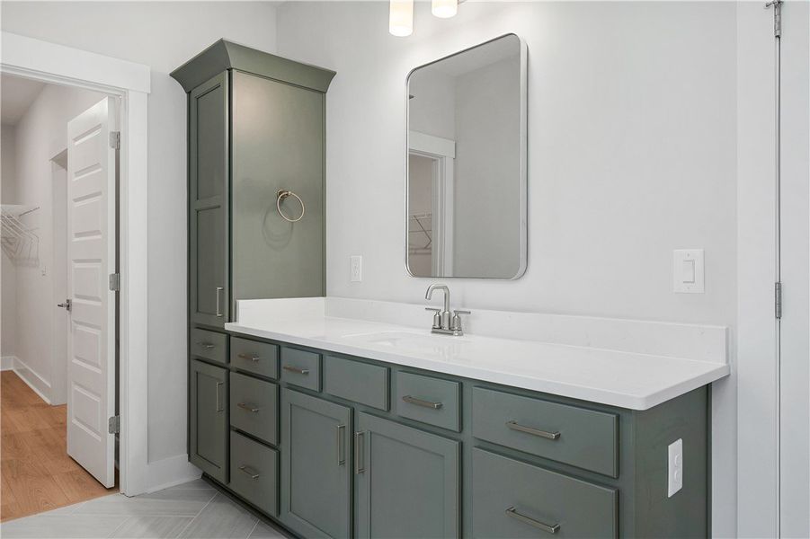 A well-appointed primary bathroom features a gener A well-appointed primary bathroom features a gener