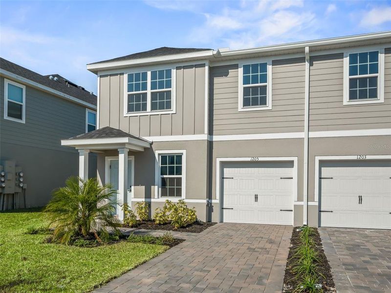 Front exterior of a new home in , Lady Lake, FL, highlighting curb appeal (Image 1).