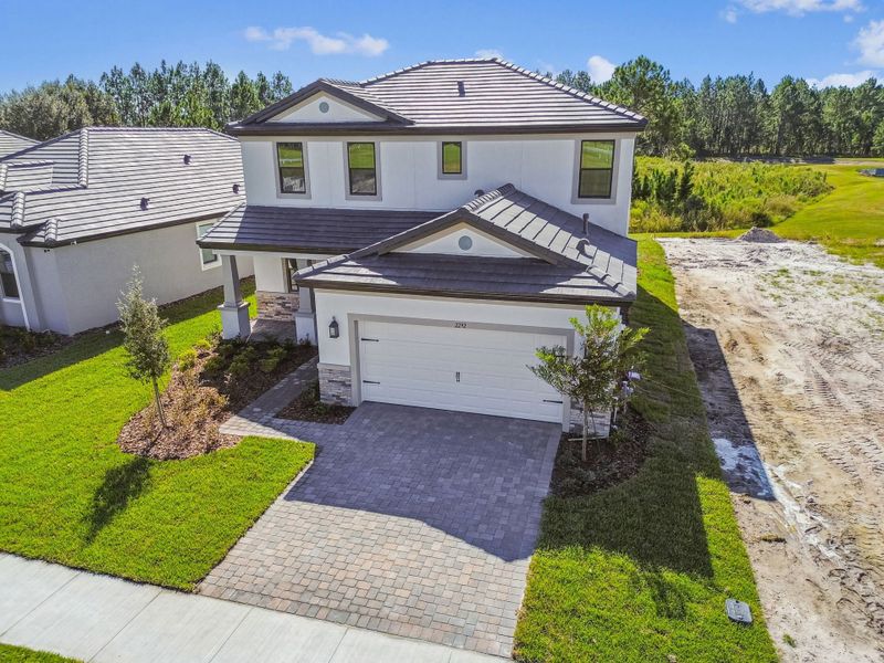 Representative exterior photo of a completed home built from the 50 ' - Saratoga by William Ryan Homes in Tamarack at Two Rivers, Zephyrhills, FL (Image 29).