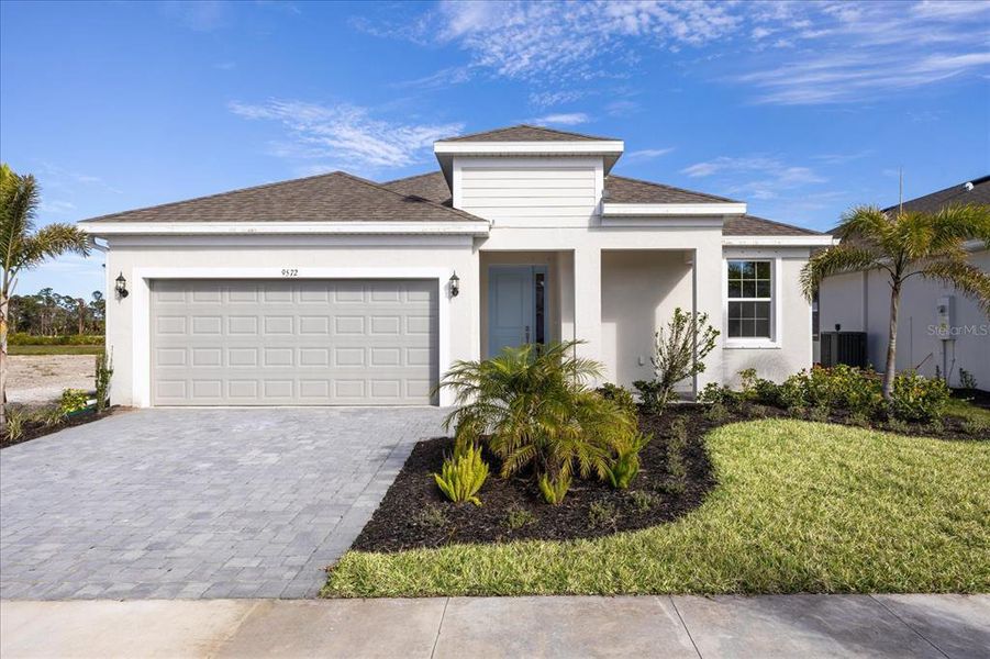 Front exterior of a new home in , Venice, FL, highlighting curb appeal (Image 1).