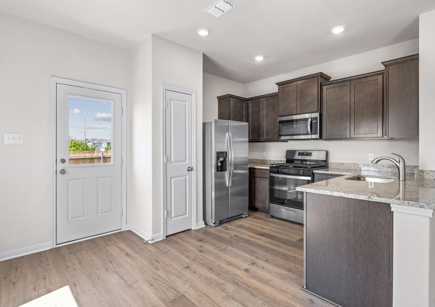 The kitchen has a pantry for additional storage.