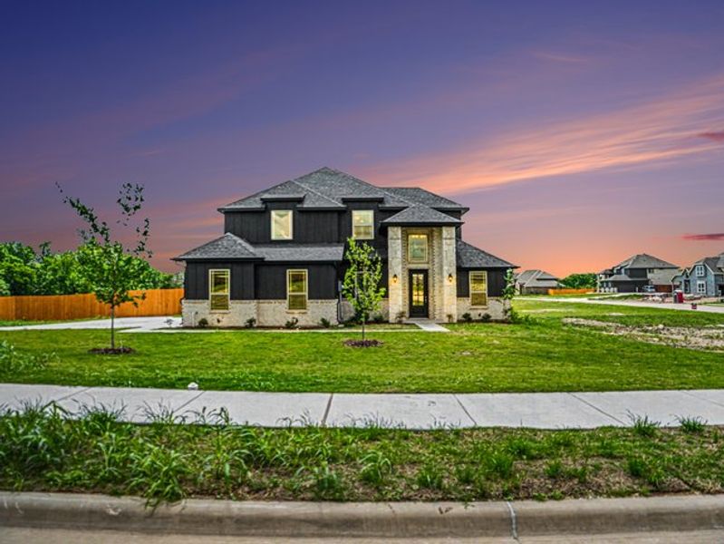 Front exterior of a new home in Ten Mile Creek Estates, DeSoto, TX, highlighting curb appeal (Image 2). Front exterior of a new home in Ten Mile Creek Estates, DeSoto, TX, highlighting curb appeal (Image 2).
