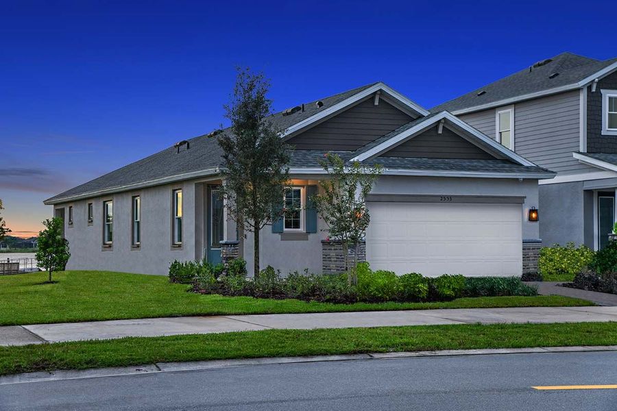 Front exterior of a new home in Myers Estates, Seffner, FL, highlighting curb appeal (Image 22).