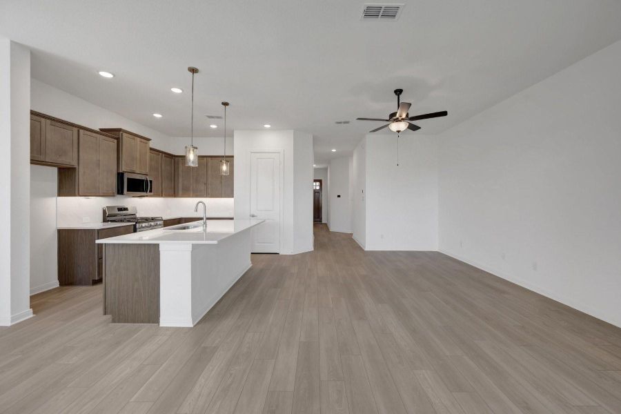 Furnished interior view inside a new home in Meridiana - Terrace Collection, Manvel (Image 6).