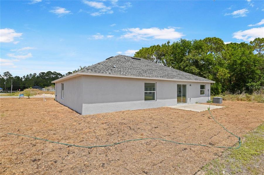 Front exterior of a new home in , Kissimmee, FL, highlighting curb appeal (Image 14).
