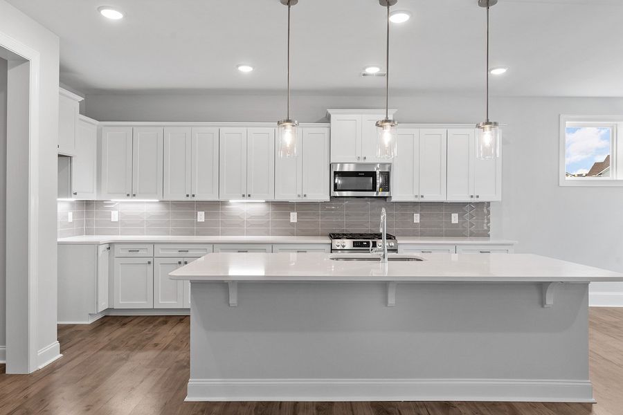Representative furnished interior of a home built from the The Bradley by RobuckHomes in Windwater, Hampstead (Image 7).