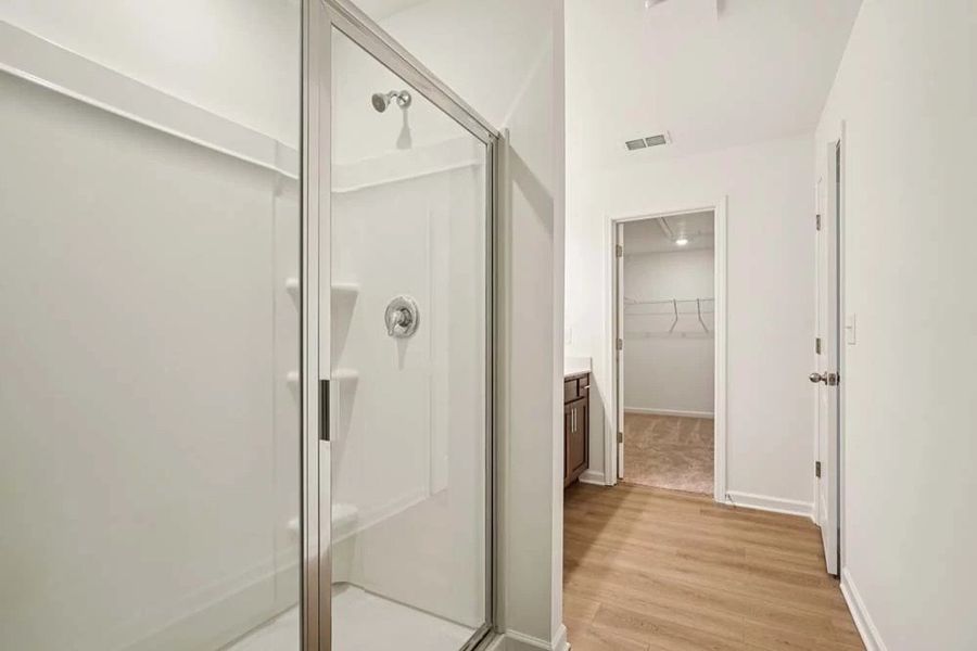 Sample Photo: Primary Bathroom Walk-In Closet Sample Photo: Primary Bathroom Walk-In Closet