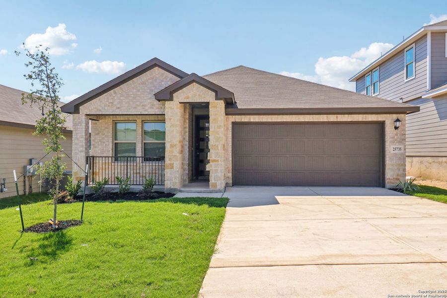 Front exterior of a new home in Scenic Crest - Premier Series, Boerne, TX, highlighting curb appeal (Image 21). Front exterior of a new home in Scenic Crest - Premier Series, Boerne, TX, highlighting curb appeal (Image 21).
