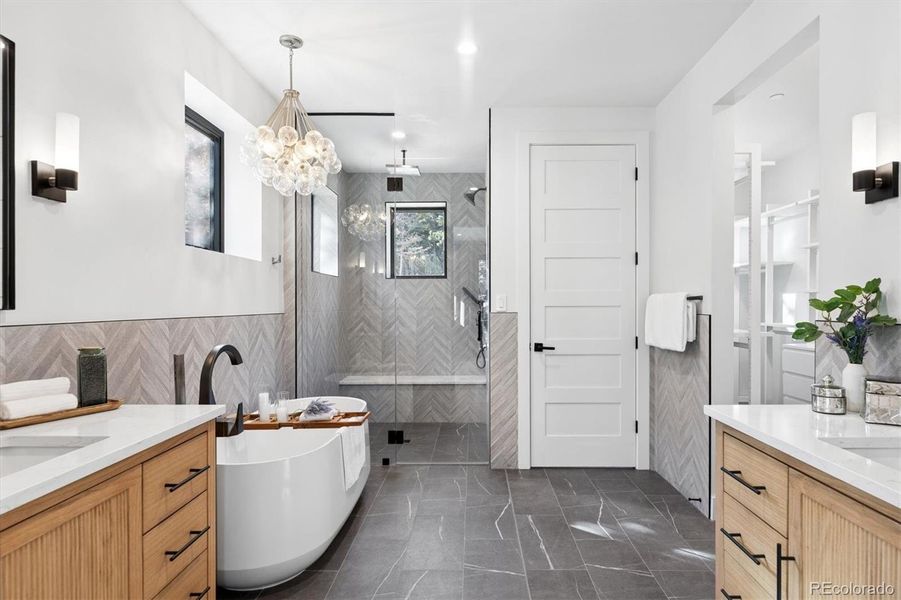 Spa Alert! Relax and unwind in this luxurious 5-piece bathroom complete with a free-standing tub, heated floors, large walk-in shower with bench seat, 3 shower heads and a private water closet Spa Alert! Relax and unwind in this luxurious 5-piece bathroom complete with a free-standing tub, heated floors, large walk-in shower with bench seat, 3 shower heads and a private water closet