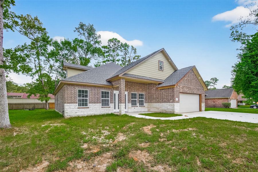 Front exterior of a new home in , Crosby, TX, highlighting curb appeal (Image 2).
