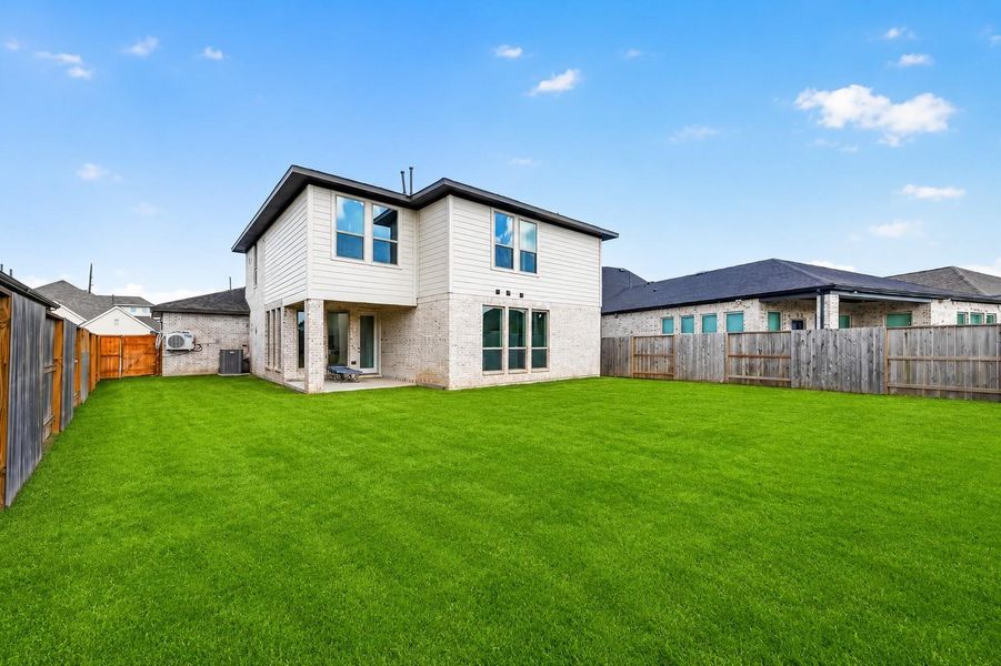 Exterior details and patio area of a home in Cane Island, Katy (Image 26).