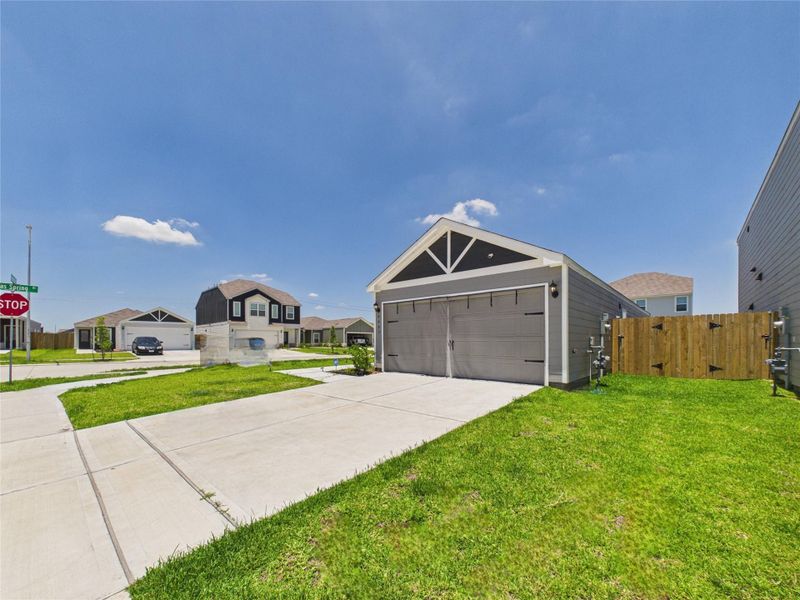 Front exterior of a new home in Park Vista at El Tesoro, Houston, TX, highlighting curb appeal (Image 25).