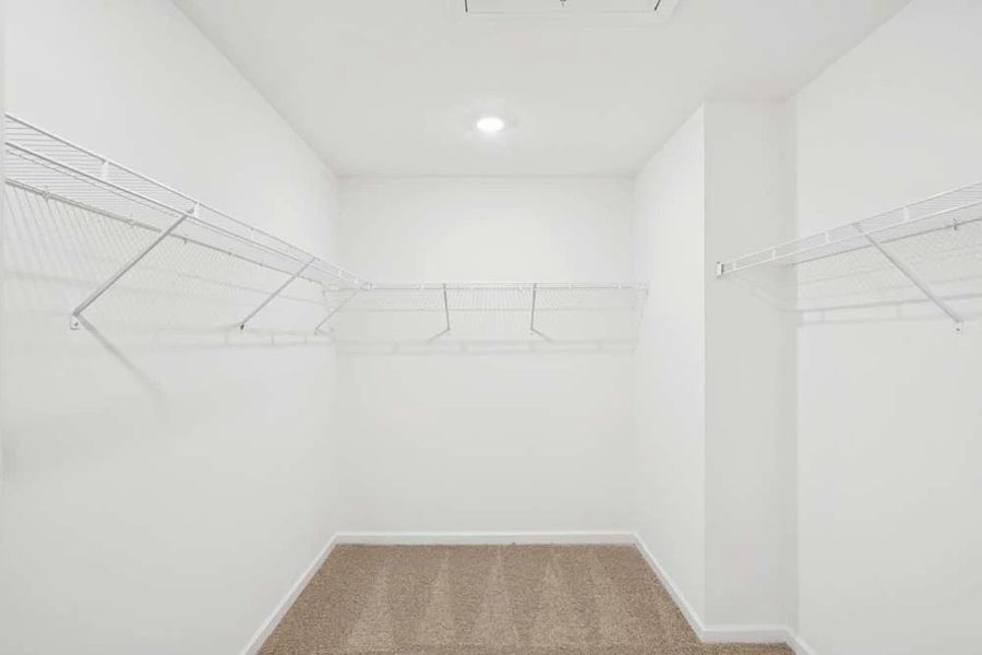 Primary Bedroom Walk-in Closet Primary Bedroom Walk-in Closet