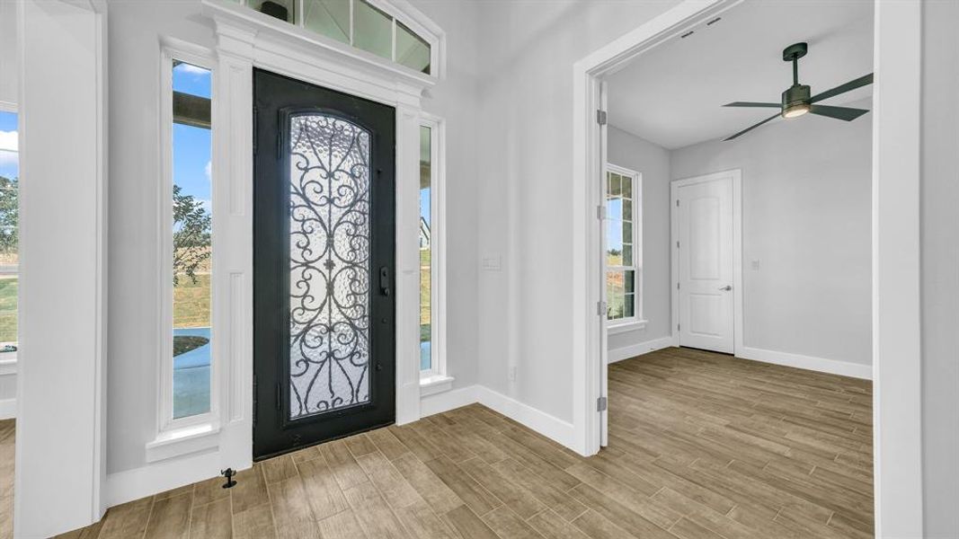 Entryway with a chandelier and light hardwood / wood-style flooring