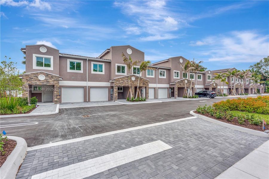 Front exterior of a new home in , Coral Springs, FL, highlighting curb appeal (Image 16).