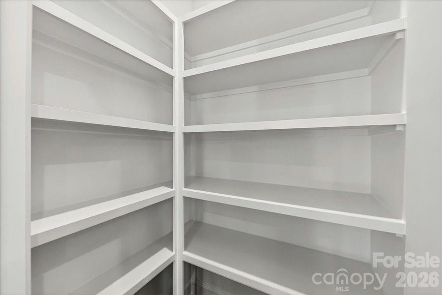 Upgraded kitchen pantry with built-in shelving Upgraded kitchen pantry with built-in shelving